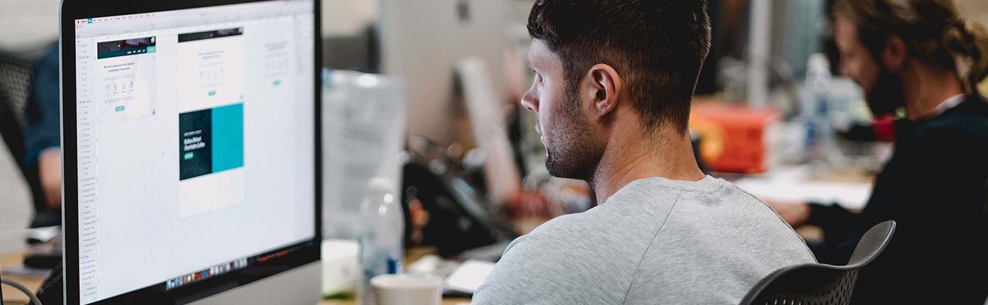 Man working on computer banner-03